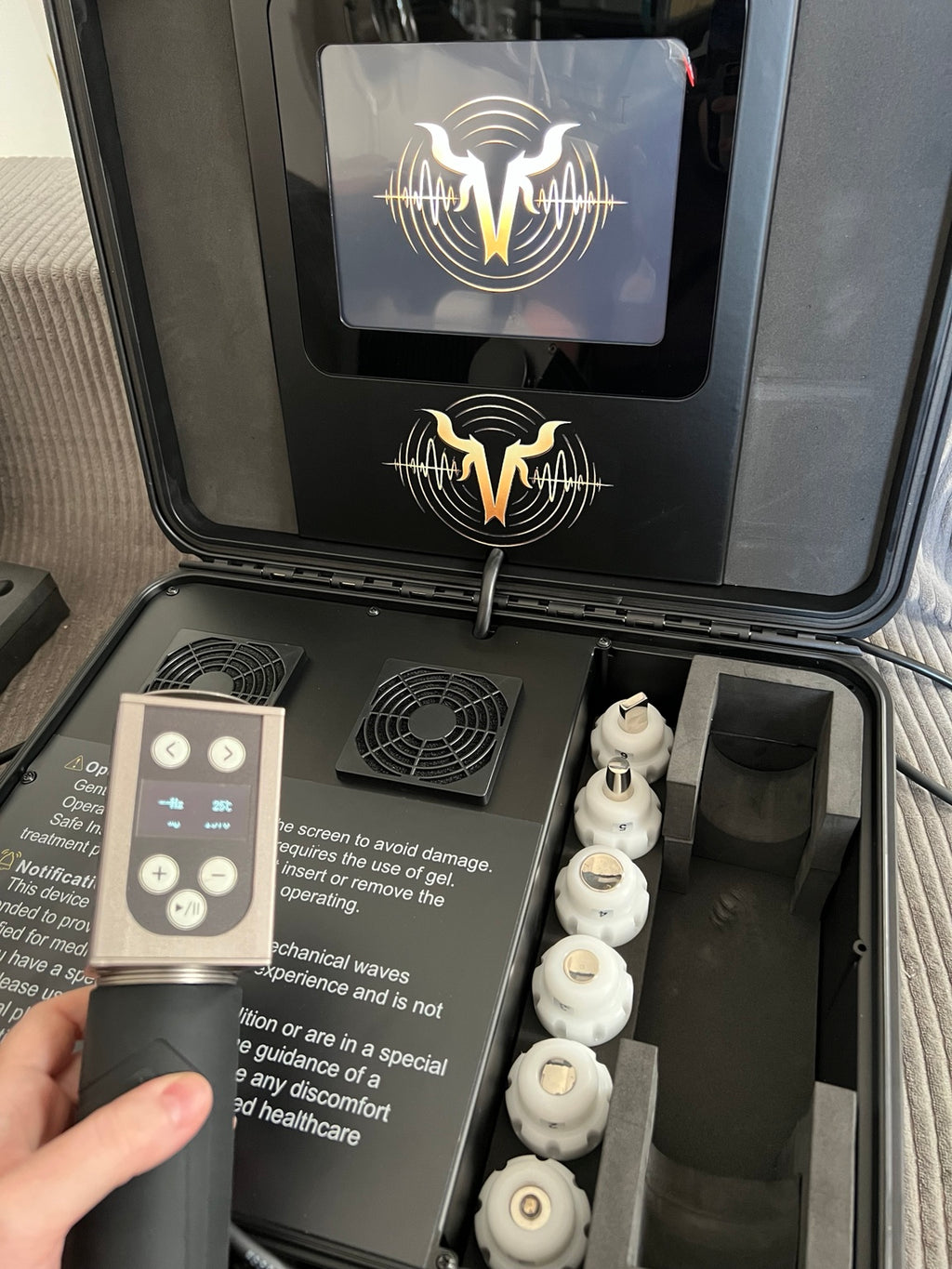 VanHorn equine shockwave therapy handpiece with onboard controls and touchscreen system