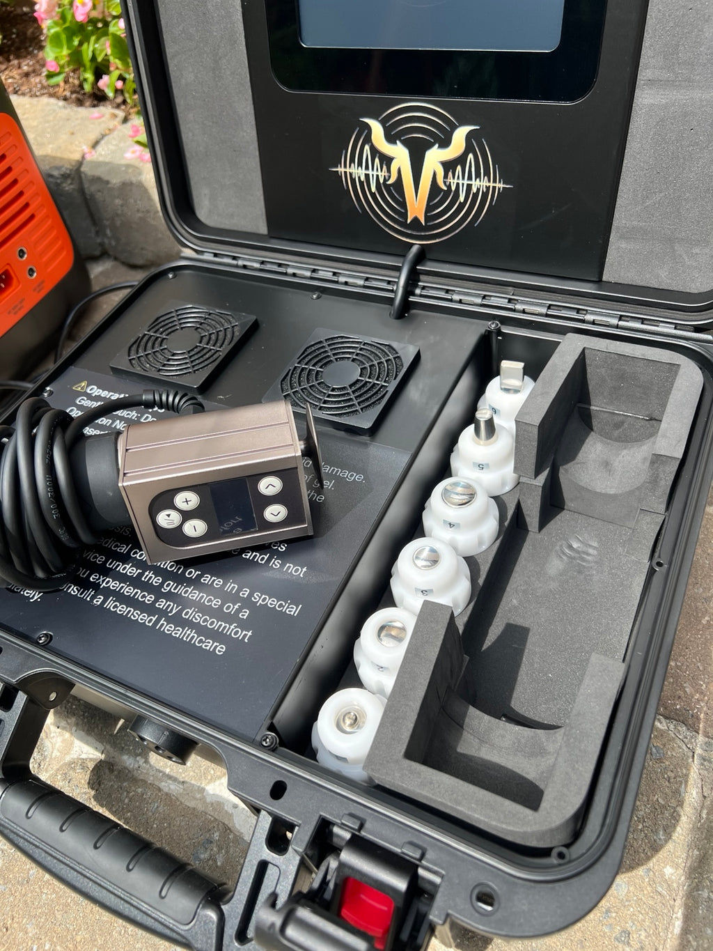 Close-up of VanHorn equine shockwave handpiece and interchangeable treatment tips