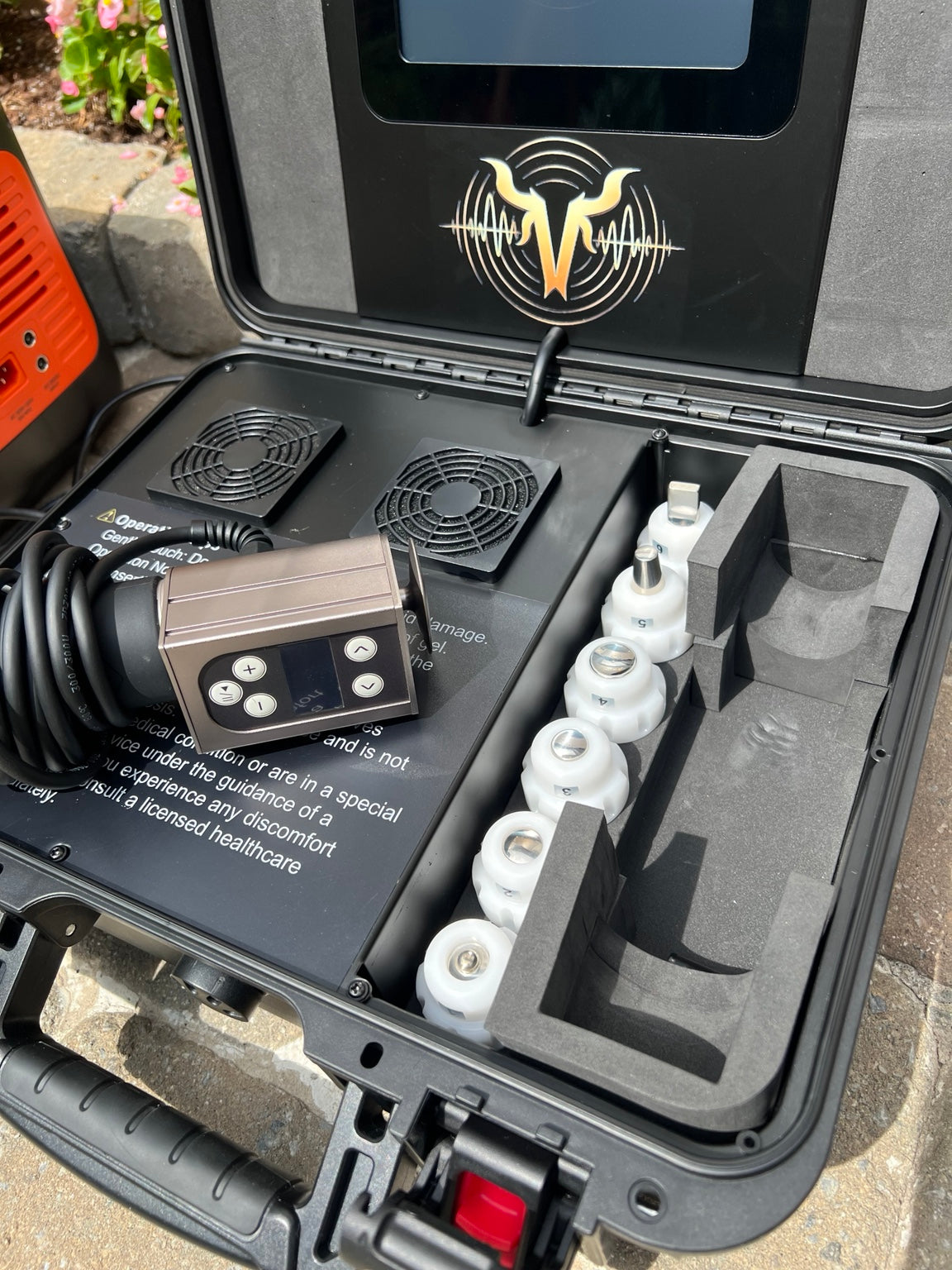 Close-up of VanHorn equine shockwave handpiece and interchangeable treatment tips